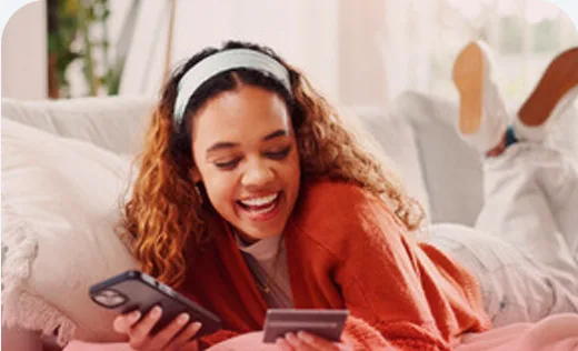 Woman paying safely with her bank card and phone